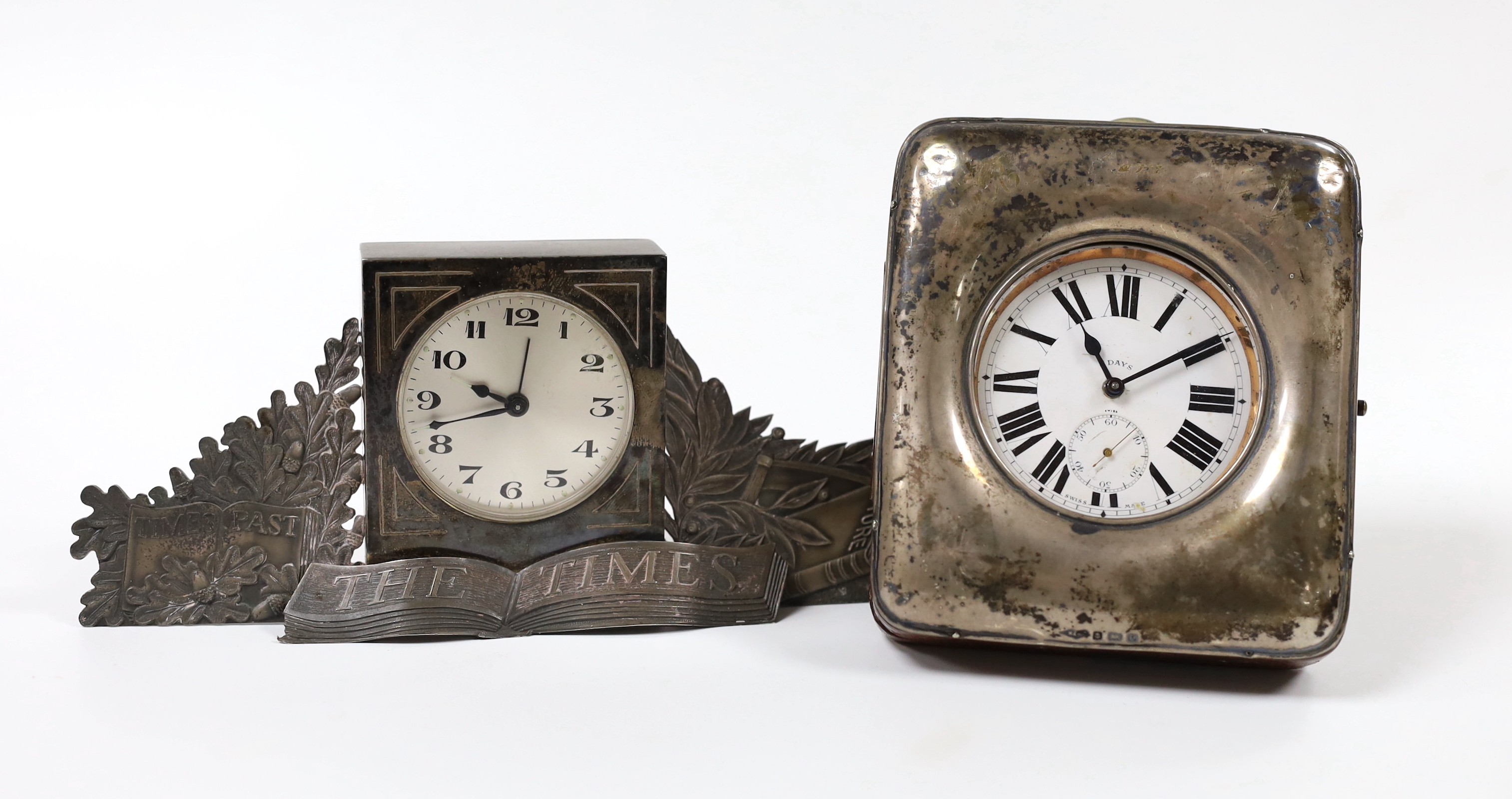 An Edwardian silver mounted leather travelling watch case, Birmingham, 1904, containing an 8 day nickel cased watch, 11.4cm, together with a modern silver mounted 'The Times' mantel timepiece by Fattorini and Sons.